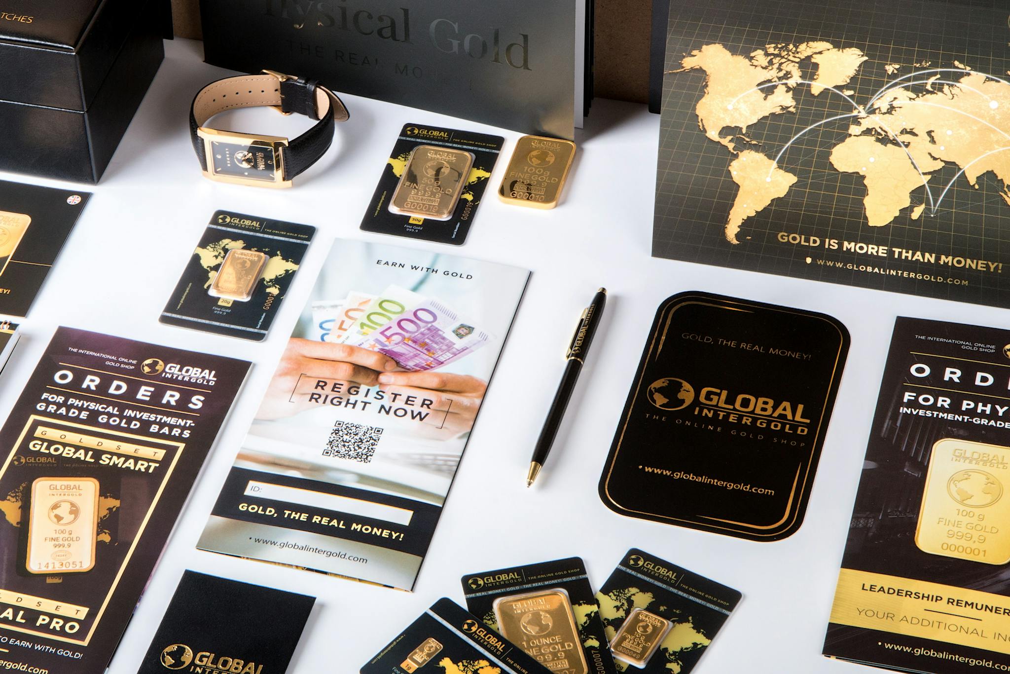 Contact Flat lay of promotional materials for gold investment, featuring brochures, cards, and gold bars.