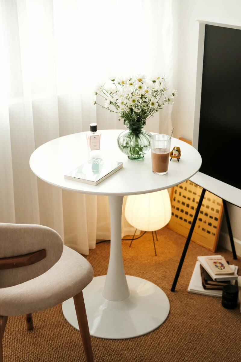 Modern home décor accessories styled on a minimalist table
